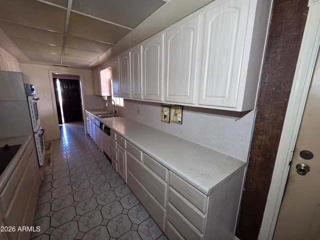 a view of a refrigerator in a kitchen
