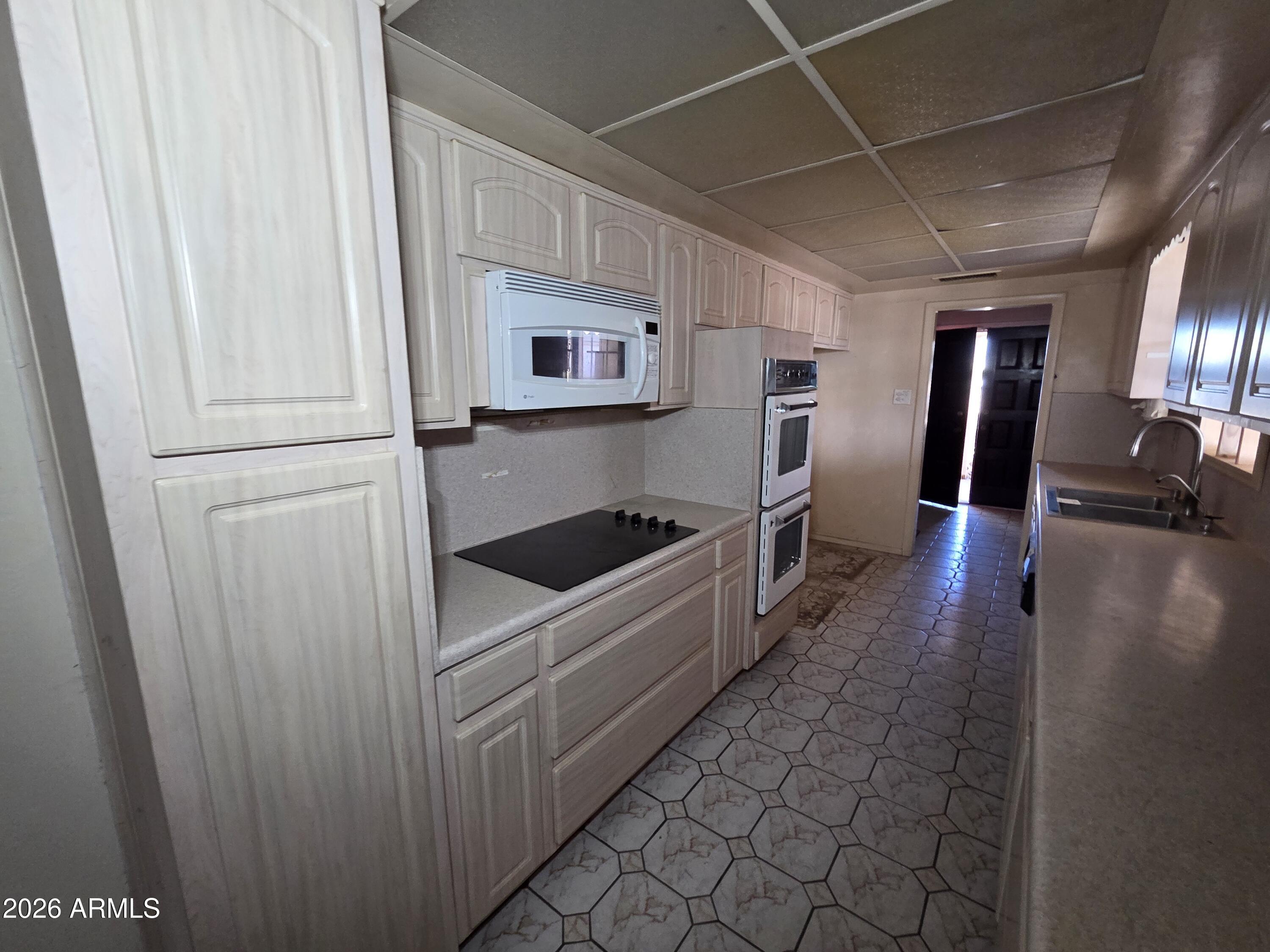 3237 West Pierce Street Phoenix, AZ 85009 - Photo 20 of 20 a view of a refrigerator in a kitchen