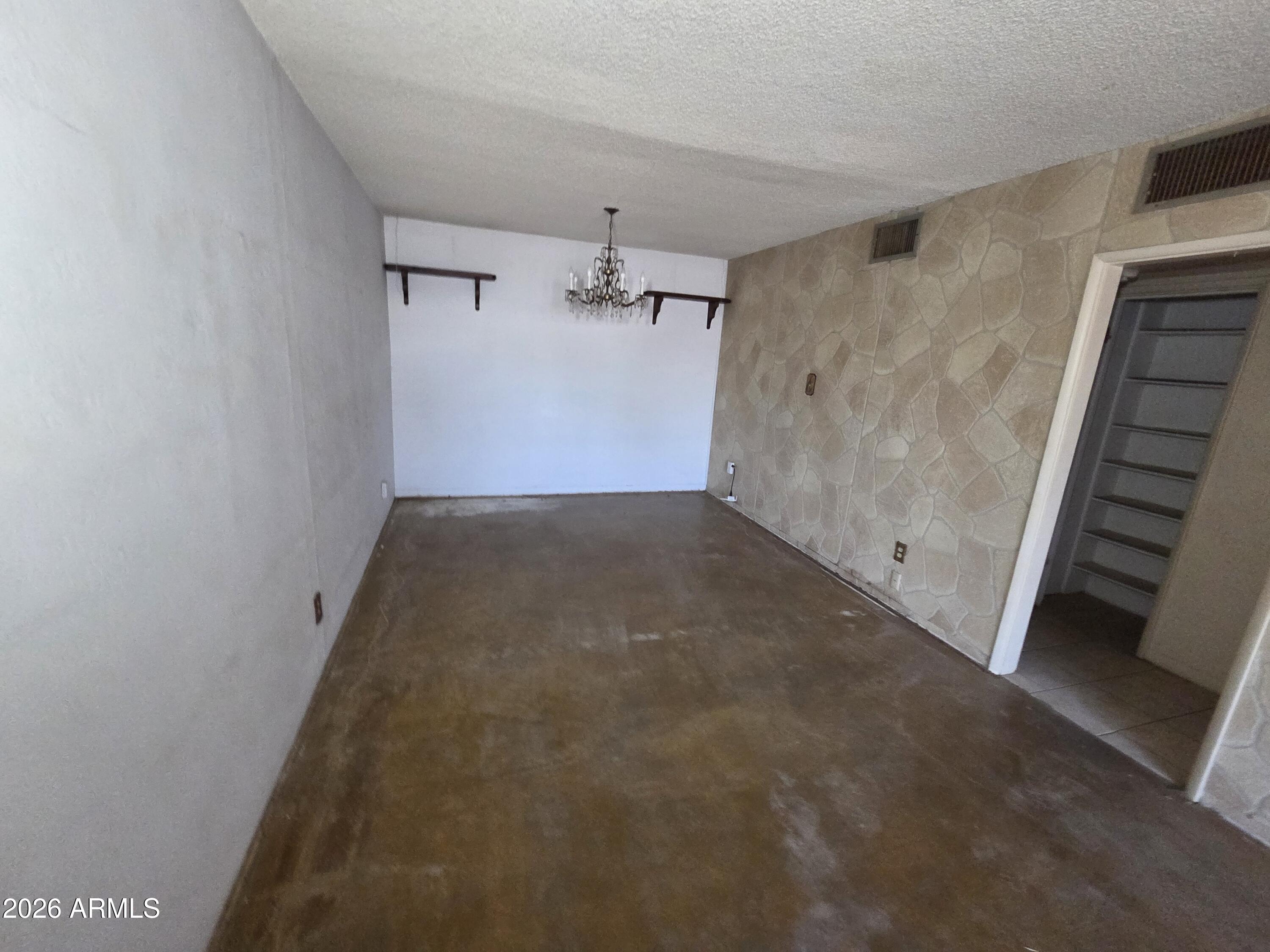3237 West Pierce Street Phoenix, AZ 85009 - Photo 3 of 20 a view of a big room with wooden floor and staircase