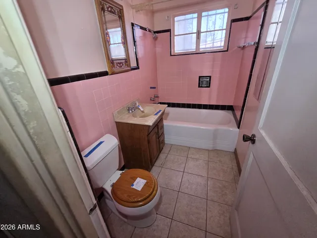 a bathroom with a sink and toilet
