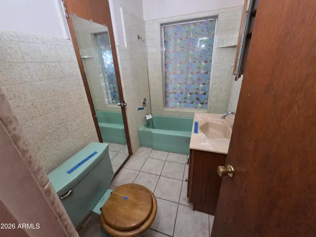 a view of a livingroom with an empty space and a window