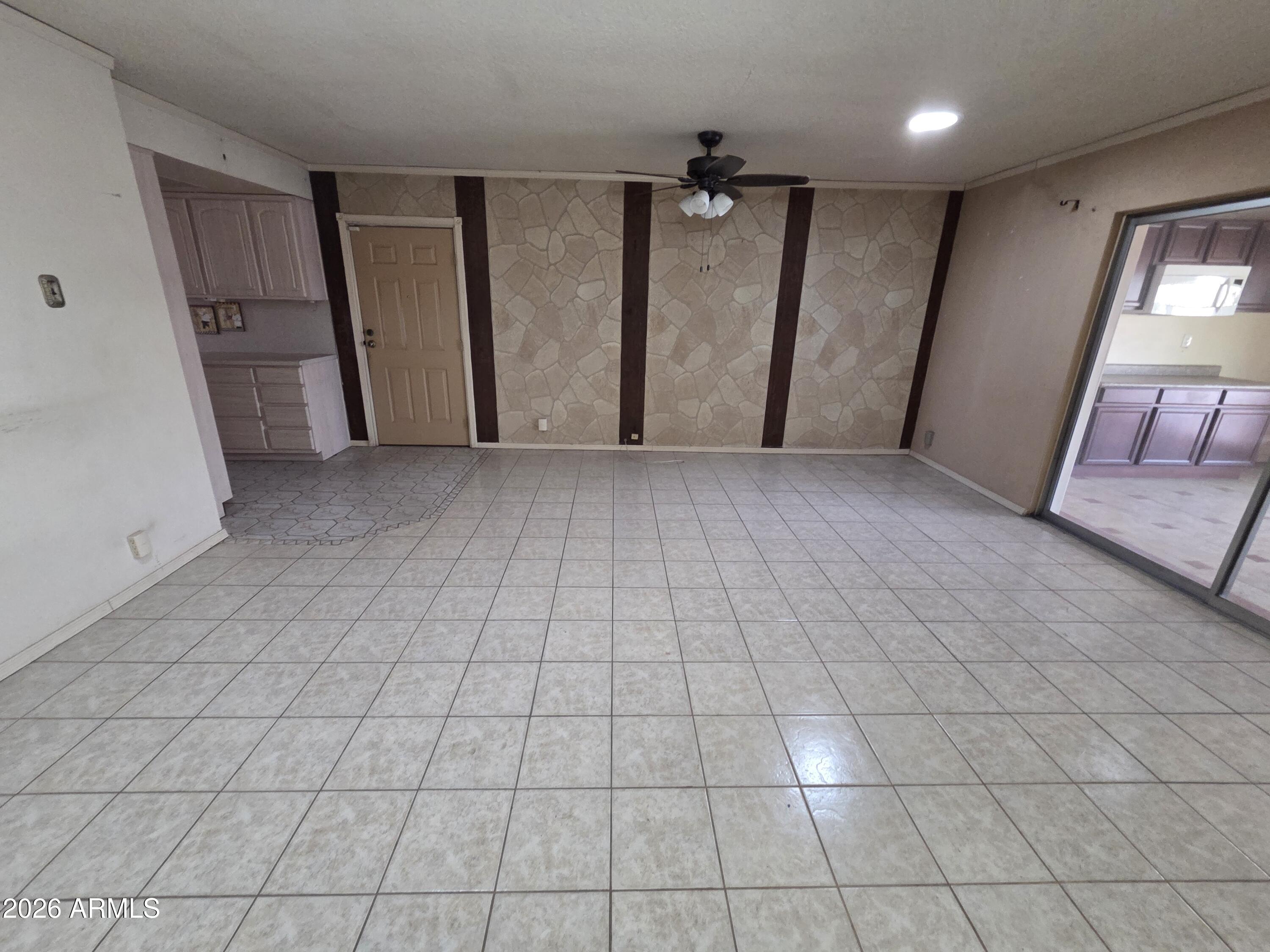 3237 West Pierce Street Phoenix, AZ 85009 - Photo 8 of 20 a view of a livingroom with an empty space and a window