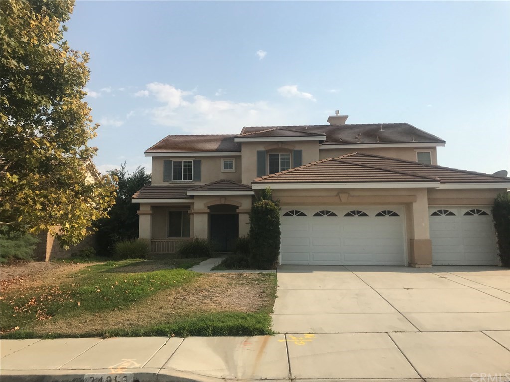 24993 Ridgemoor Road Menifee, CA 92584 - Photo 1 of 1 a front view of a house with garden