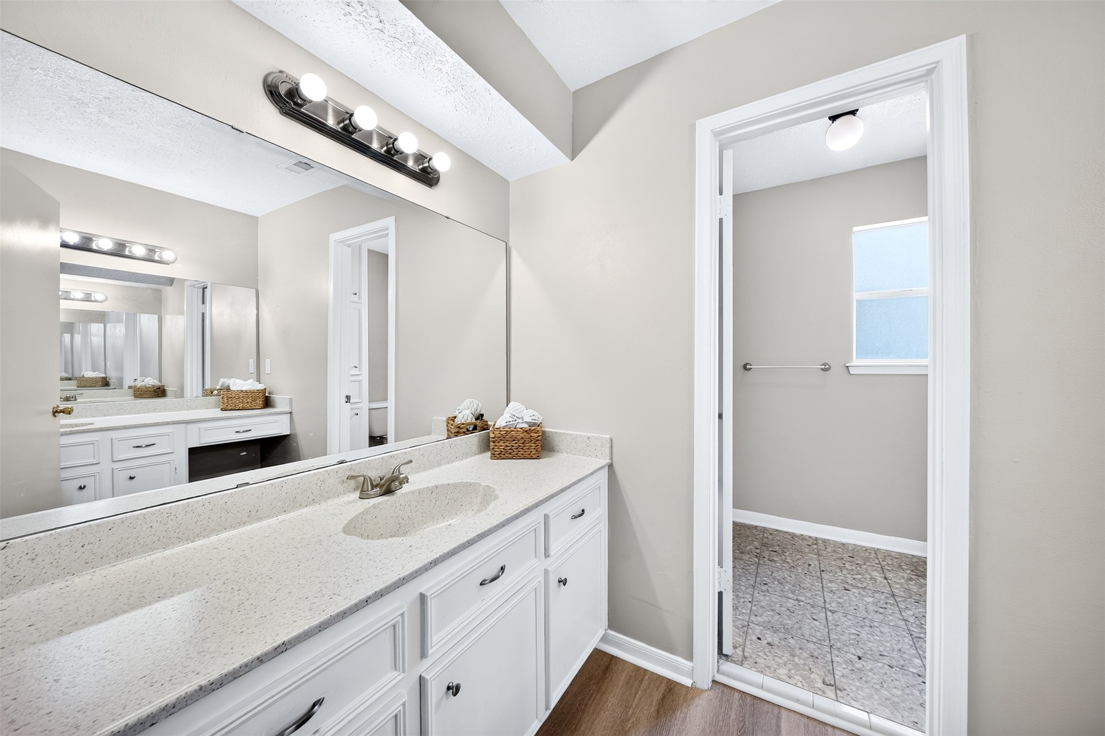 6507 Spring Leaf Drive Spring, TX 77379 - Photo 29 of 50 Second floor full bathroom with two vanities, abundant storage, oversized mirror and private tub/shower area designed for everyday convenience and comfort.