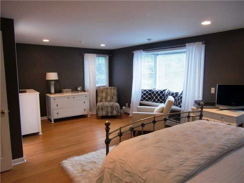 43 Long Meadow Road Riverside, CT 06878 - Photo 8 of 13 a living room with furniture and a flat screen tv