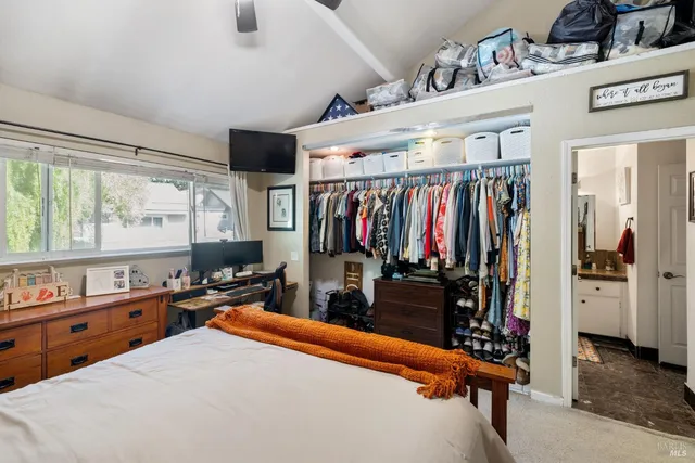 a bed room with a bed and a window