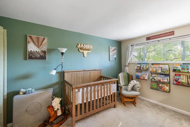 a bathroom with a sink mirror and vanity