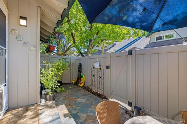 a view of a house with potted plants
