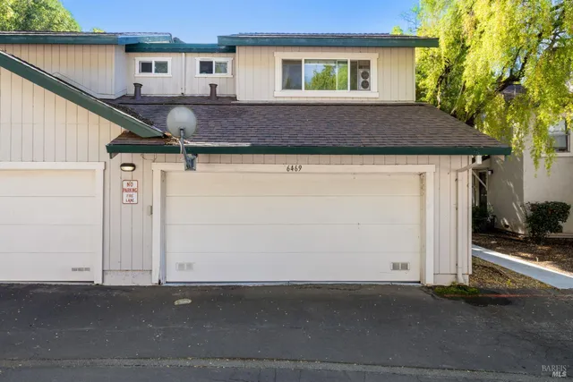 a front view of a house with yard