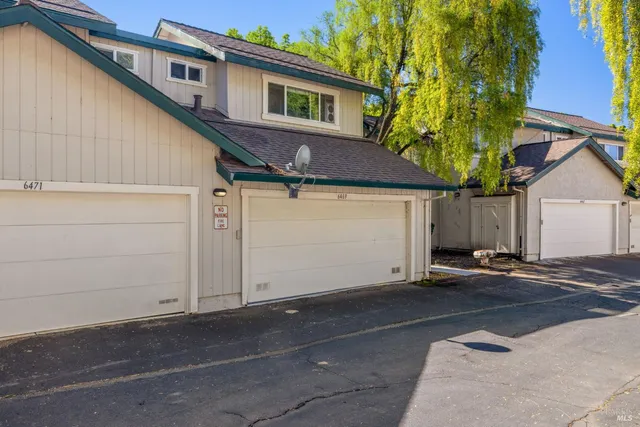a house view with a backyard space