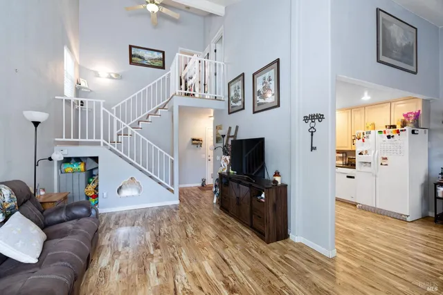 a view of a livingroom with furniture and a flat screen tv