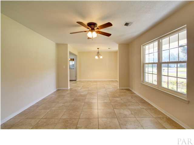 7530 Templeton Road Pensacola, FL 32506 - Photo 5 of 24 Living area and dining room.