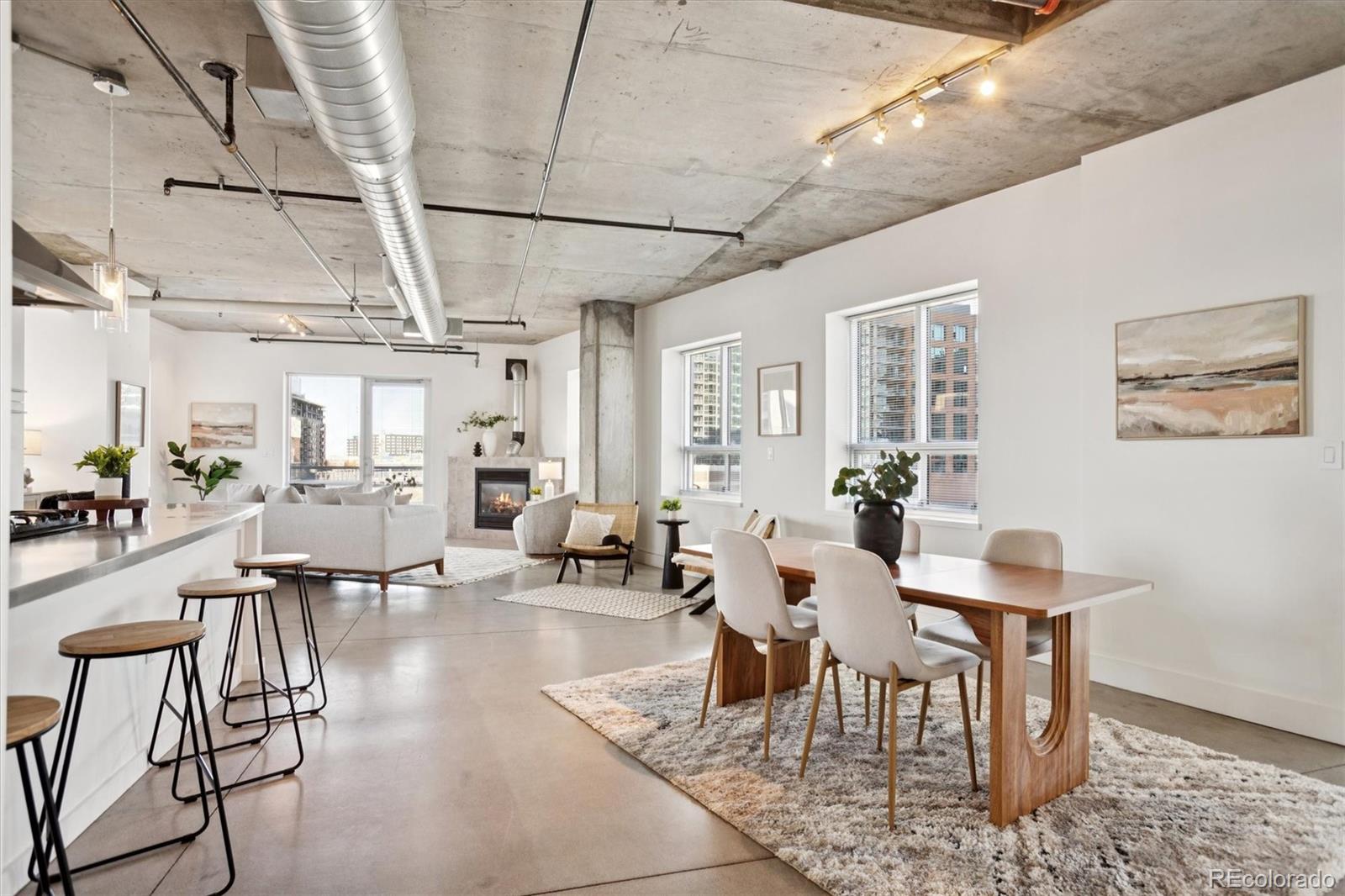 1610 Little Raven Street, Unit 511 Denver, CO 80202 - Photo 17 of 34 a view of a dining room with furniture