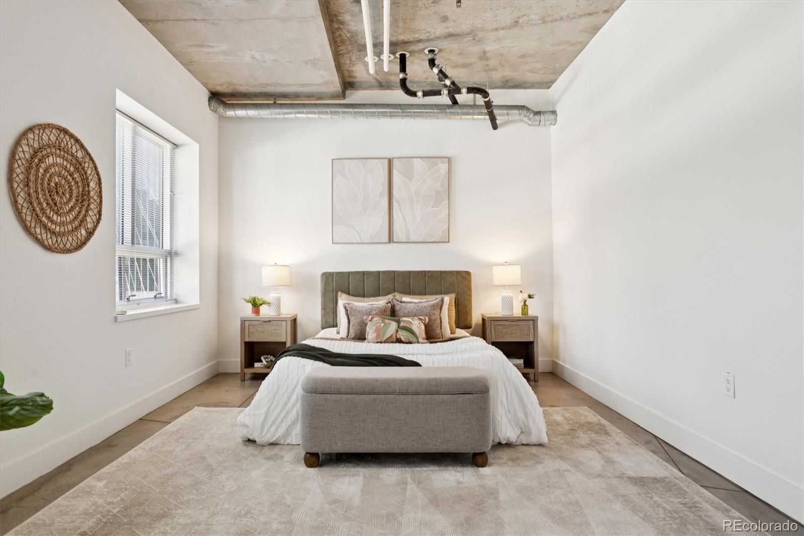 1610 Little Raven Street, Unit 511 Denver, CO 80202 - Photo 18 of 34 a bedroom with a bed and a window