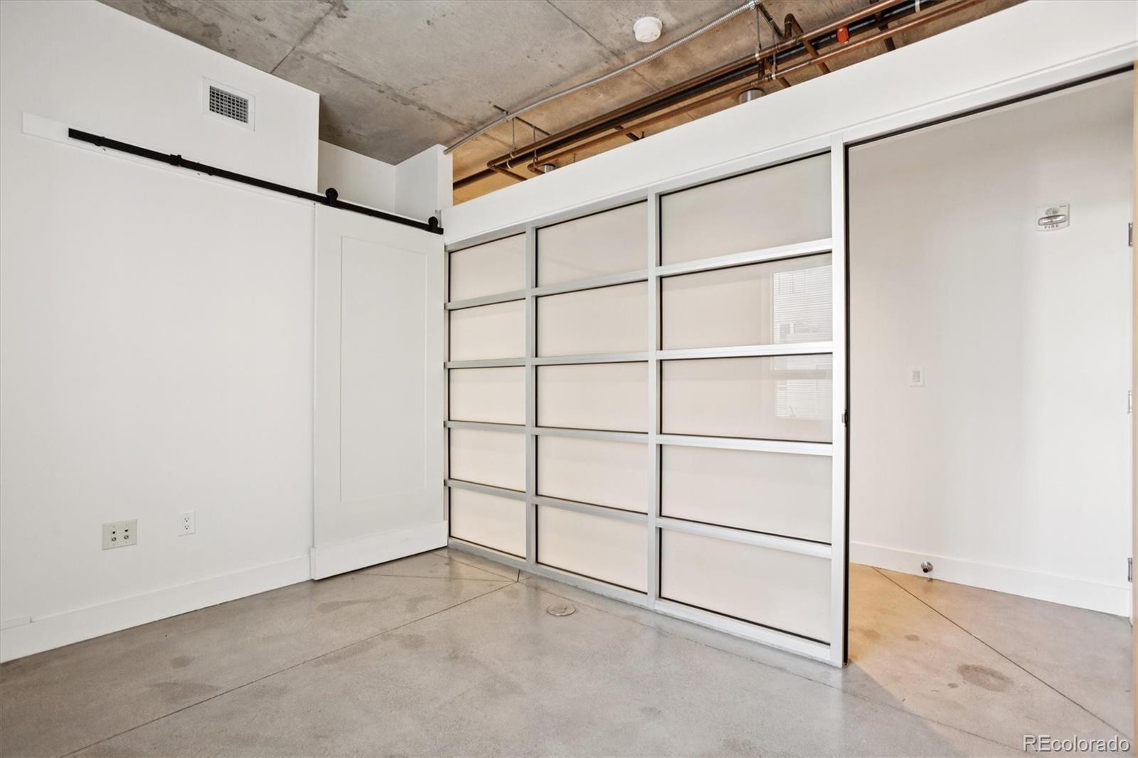 1610 Little Raven Street, Unit 511 Denver, CO 80202 - Photo 25 of 34 a view of a room with rack on the wall