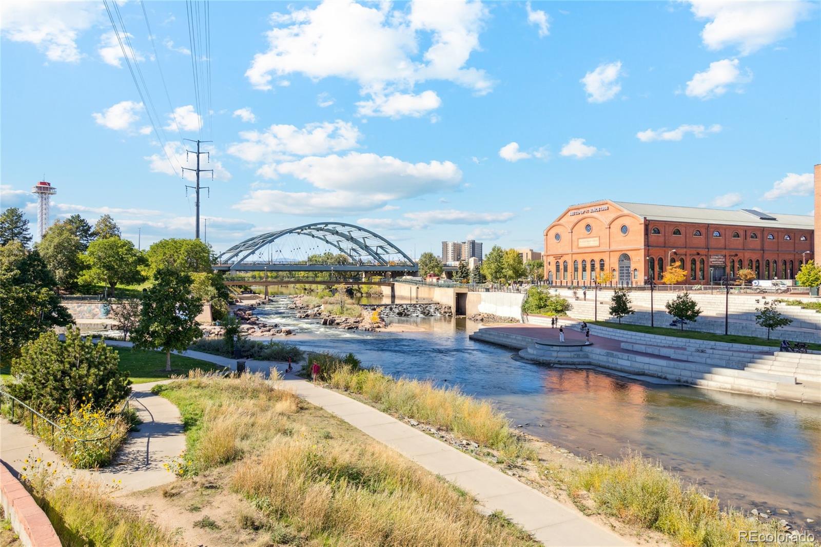1610 Little Raven Street, Unit 511 Denver, CO 80202 - Photo 34 of 34 a view of a swimming pool with a table and chairs