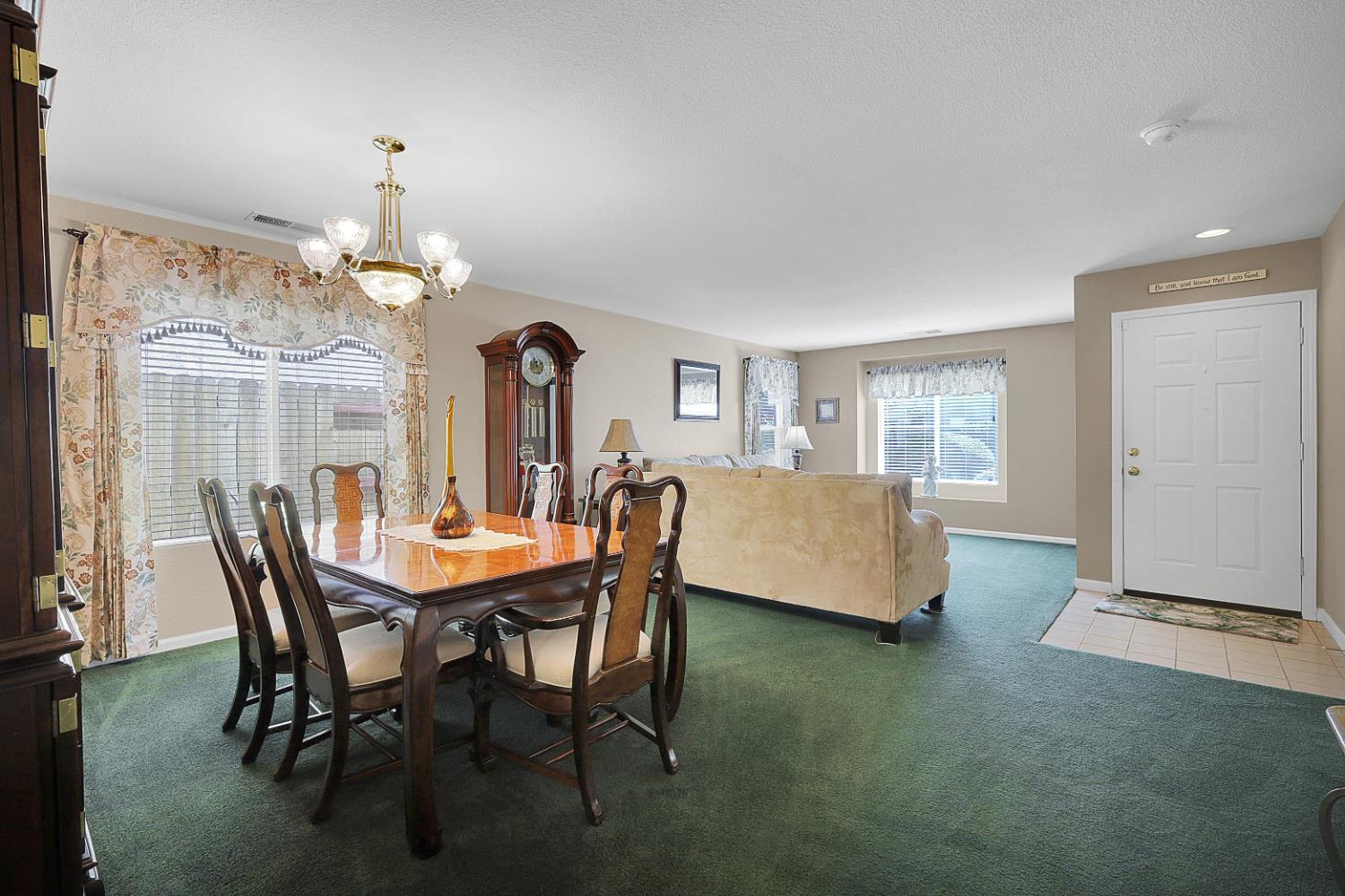 9840 Ellis Way Live Oak, CA 95953 - Photo 10 of 44 a view of a dining room with furniture and chandelier
