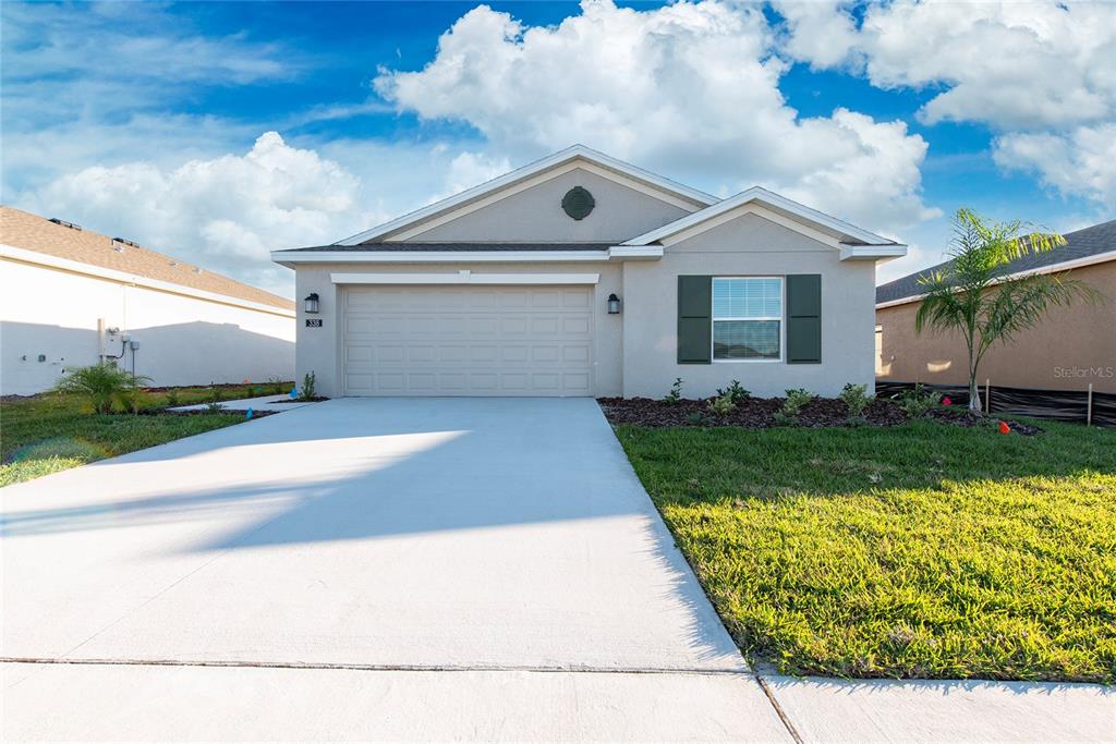 338 Rustic Rail Dr Lake Lake Wales, FL 33859 - Photo 1 of 22 a front view of a house with a yard