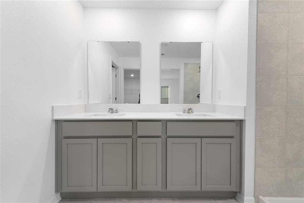 338 Rustic Rail Dr Lake Lake Wales, FL 33859 - Photo 11 of 22 a bathroom with 2 sink and a mirror