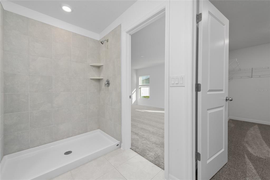 338 Rustic Rail Dr Lake Lake Wales, FL 33859 - Photo 12 of 22 a bathroom with a bath tub