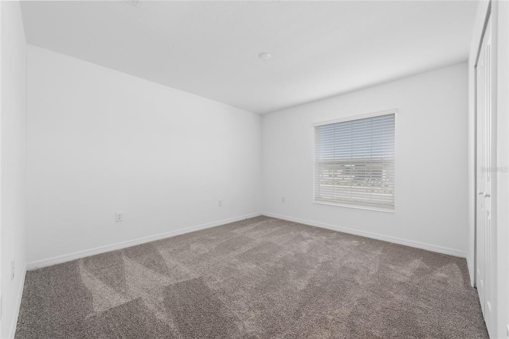 338 Rustic Rail Dr Lake Lake Wales, FL 33859 - Photo 19 of 22 an empty room with a empty space and windows