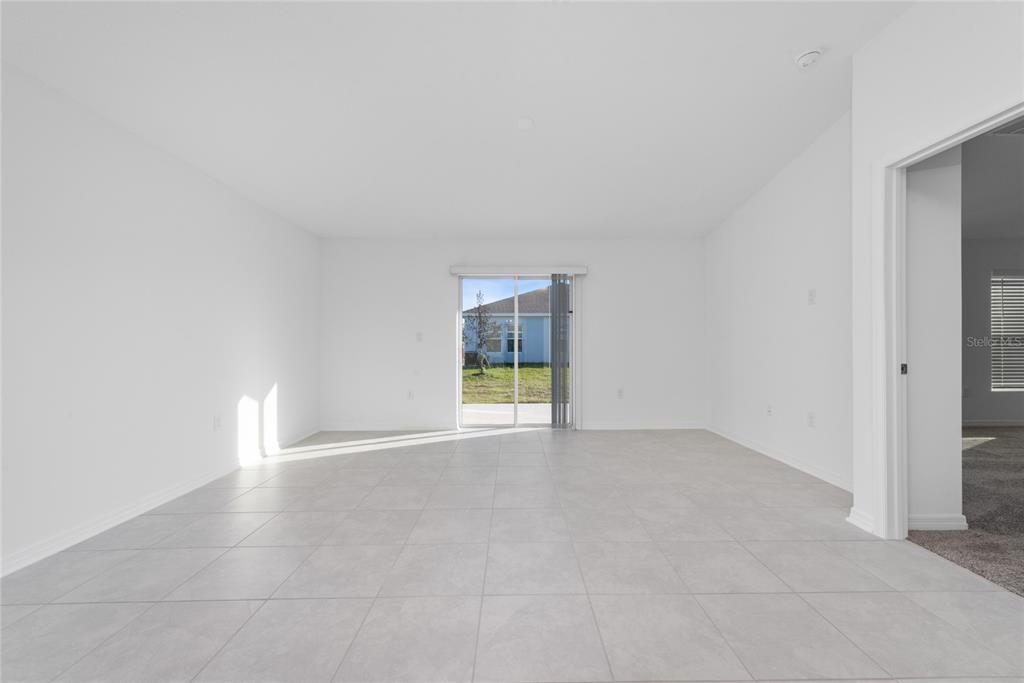 338 Rustic Rail Dr Lake Lake Wales, FL 33859 - Photo 6 of 22 an empty room with windows and yard