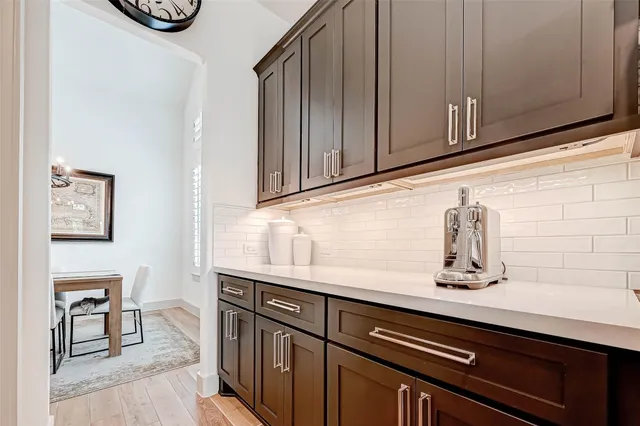 a kitchen with a sink cabinets and window