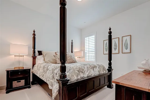 a bedroom with a bed and a dresser