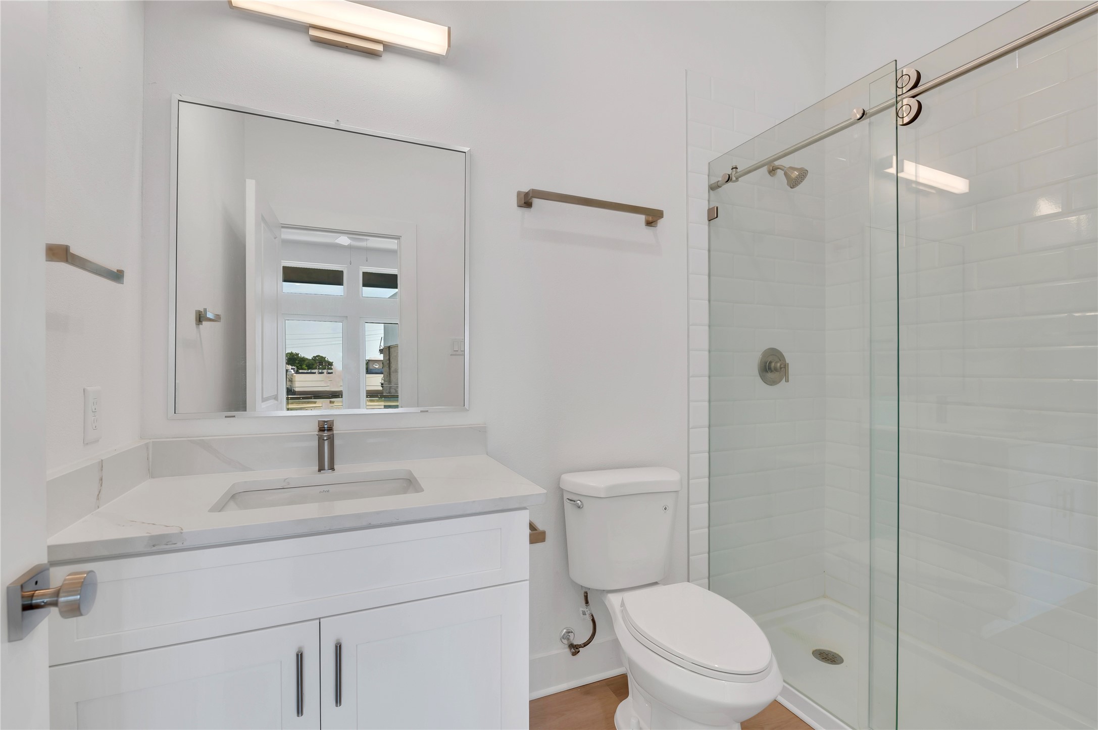 119 Kirby Road, Unit 5205 Seabrook, TX 77586 - Photo 28 of 46 Bright and modern bathroom featuring a sleek vanity, glass-enclosed shower, and elegant fixtures for a contemporary feel.