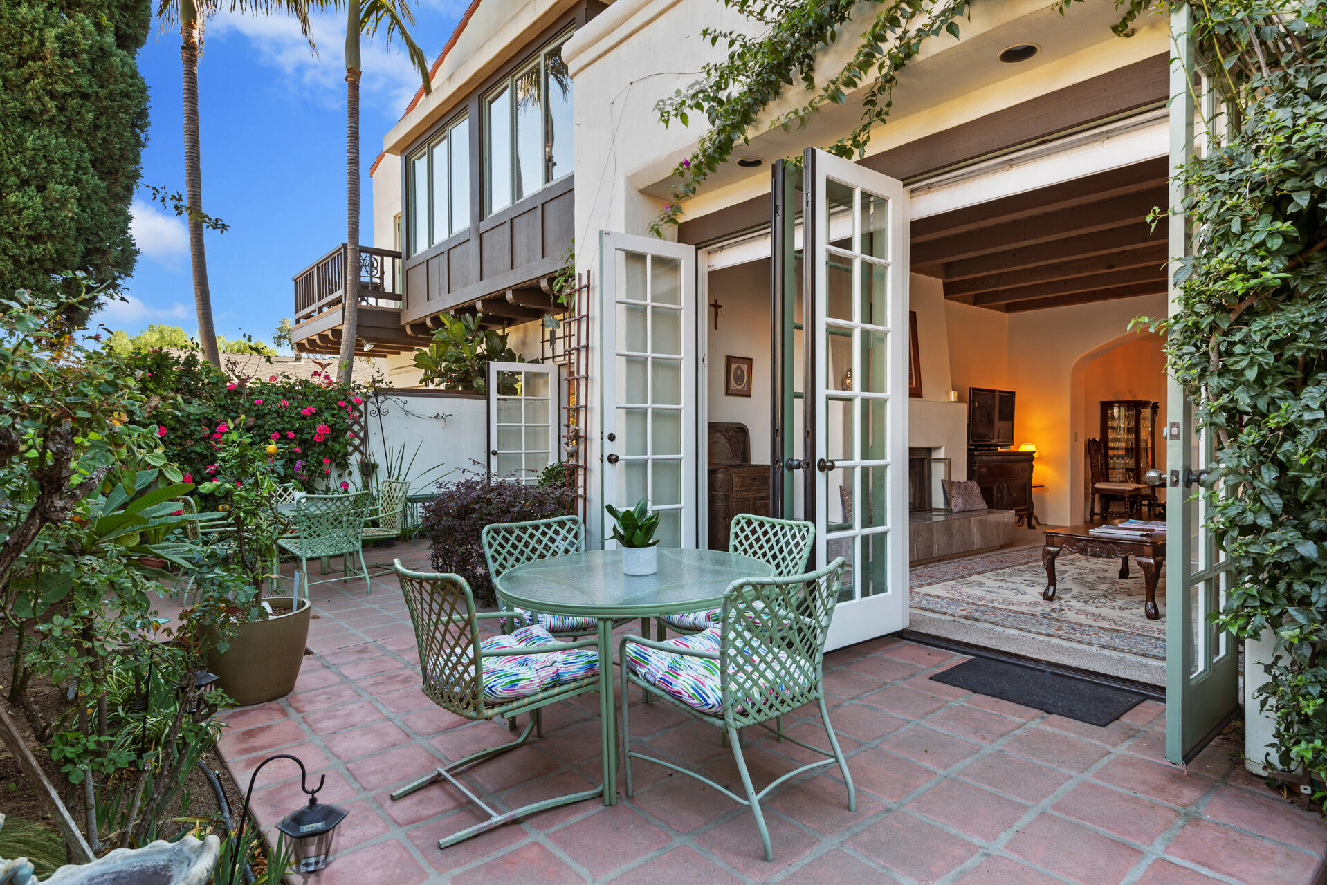 Undisclosed Address Santa Barbara, CA 93101 - Photo 12 of 25 a view of a patio with a table and chairs and potted plants