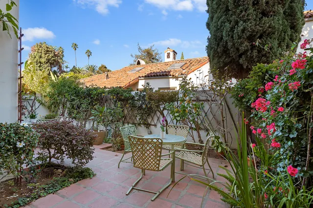 a view of a chairs and table in the patio