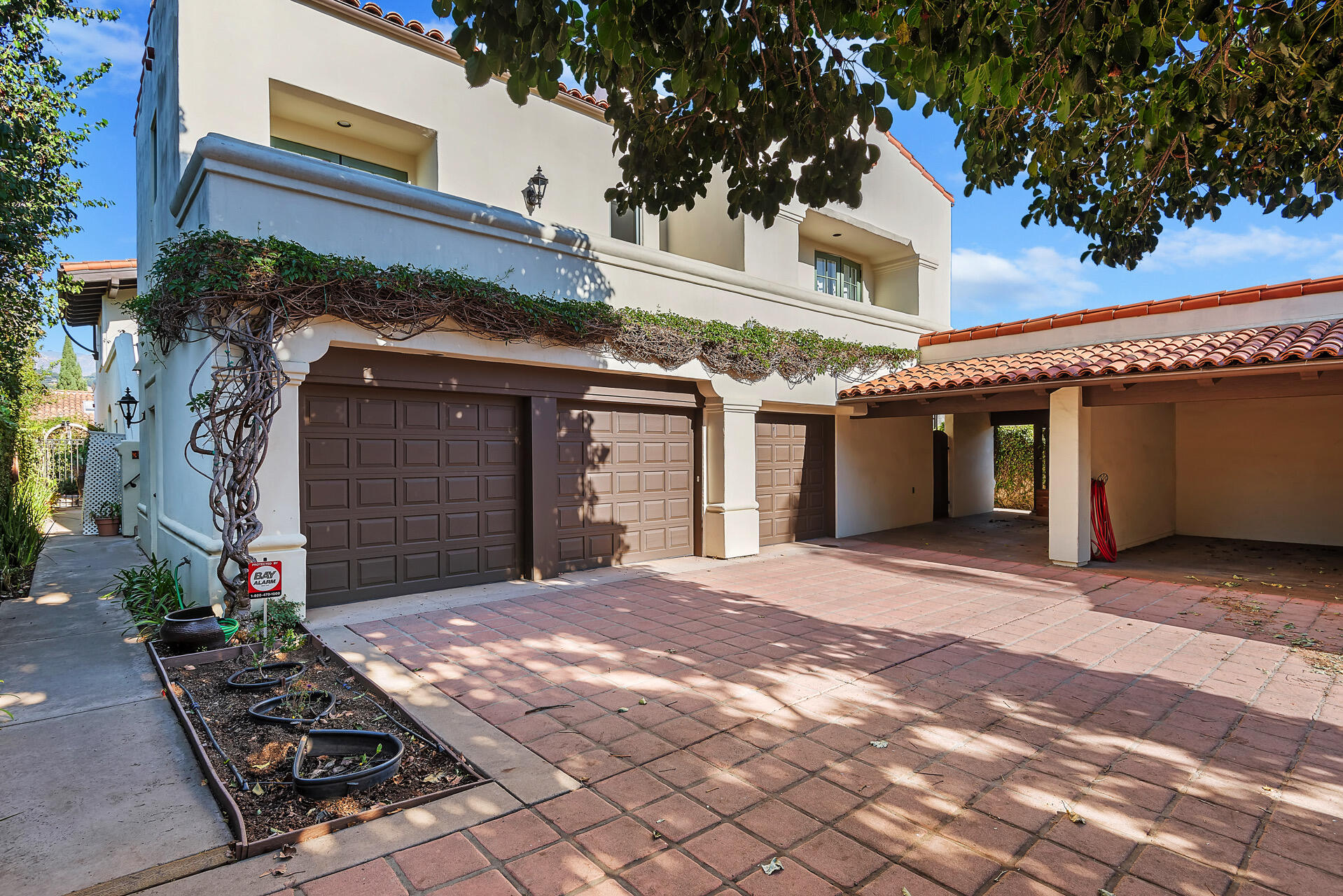 Undisclosed Address Santa Barbara, CA 93101 - Photo 18 of 25 a front view of a building with a yard and a garage