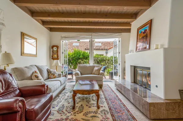 a living room with furniture and a fireplace