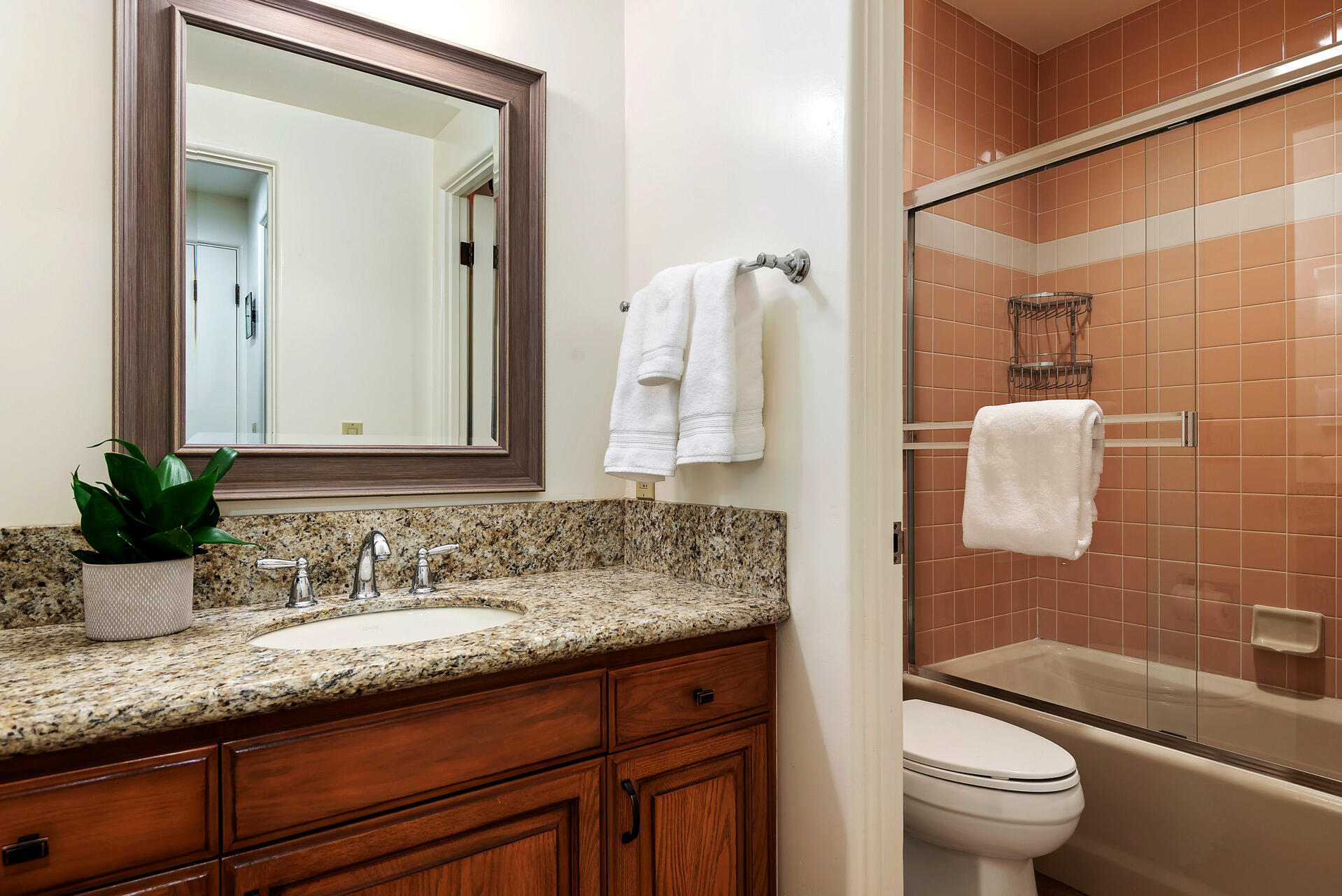 Undisclosed Address Santa Barbara, CA 93101 - Photo 22 of 25 a bathroom with a granite countertop sink a toilet and shower