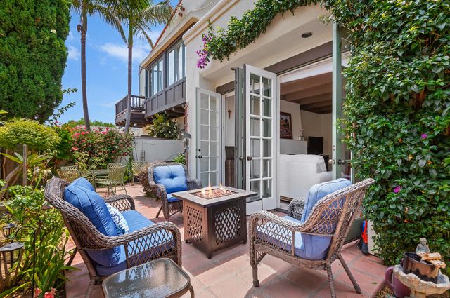 a view of a patio with couple of chairs