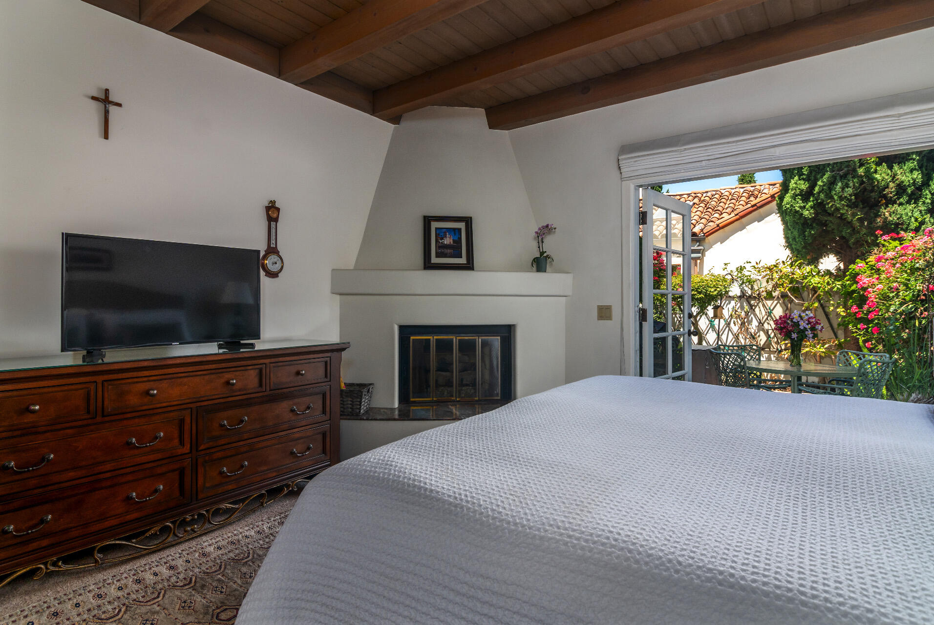 Undisclosed Address Santa Barbara, CA 93101 - Photo 6 of 25 a bedroom with a bed and a flat screen tv