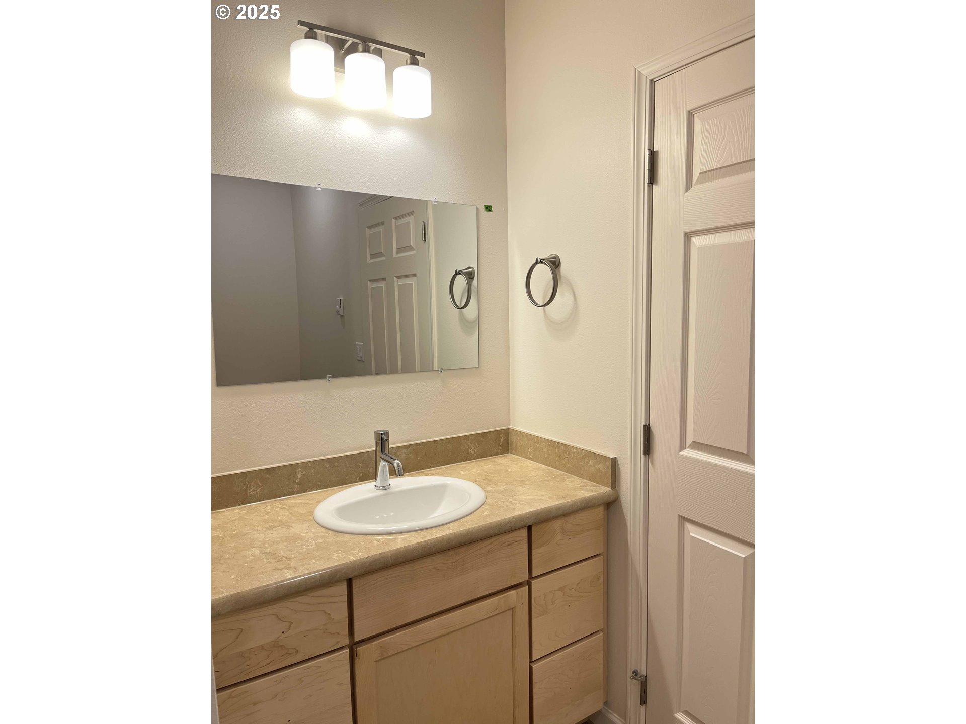 1585 37th Street Florence, OR 97439 - Photo 45 of 48 a bathroom with a sink and a mirror