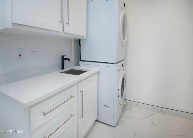 a bathroom with cabinets and a sink