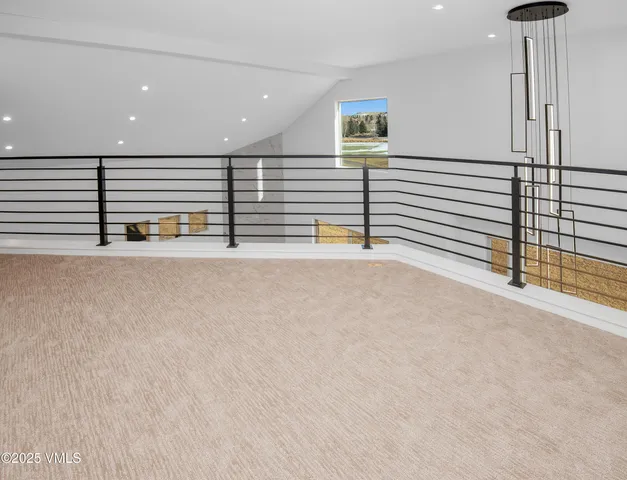 an empty room with an entryway and shower