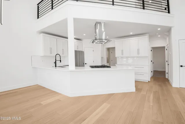 a view of kitchen with wooden floor