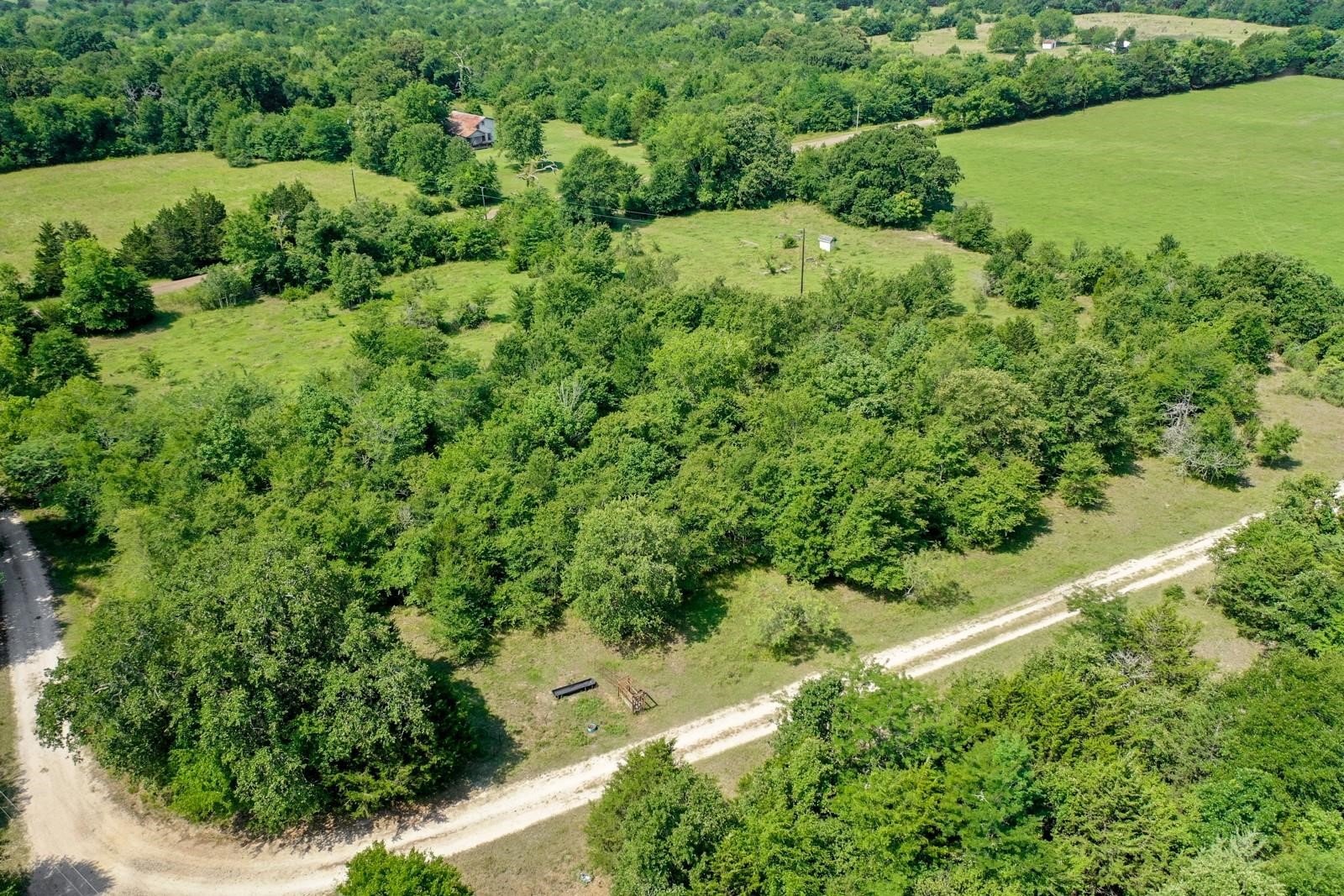 37.5-ac Antioch Road Midway, TX 75852 - Photo 5 of 24 an aerial view of a house with a yard