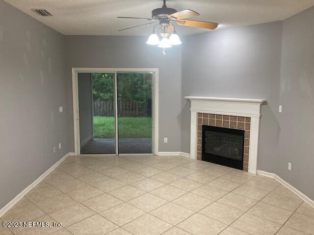 321 Stonehurst Parkway St. Augustine, FL 32092 - Photo 13 of 39 a view of an empty room with a fireplace and a window