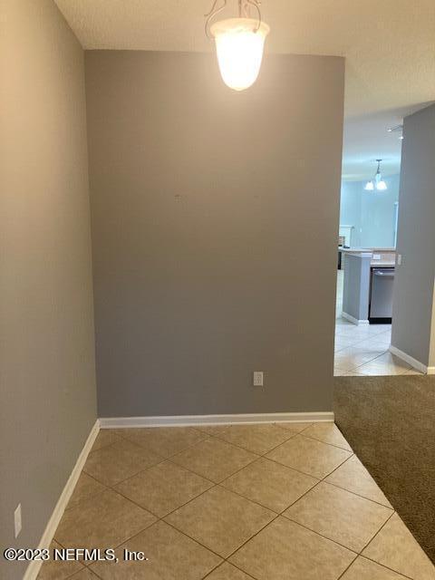 321 Stonehurst Parkway St. Augustine, FL 32092 - Photo 2 of 39 a view of an empty room with window and wooden floor