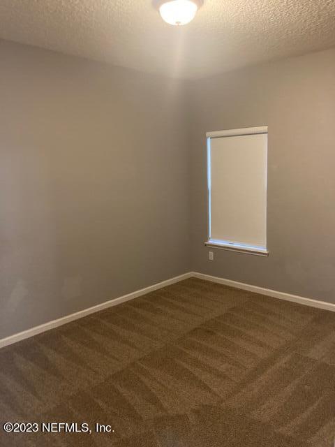 321 Stonehurst Parkway St. Augustine, FL 32092 - Photo 23 of 39 an empty room with a workbench