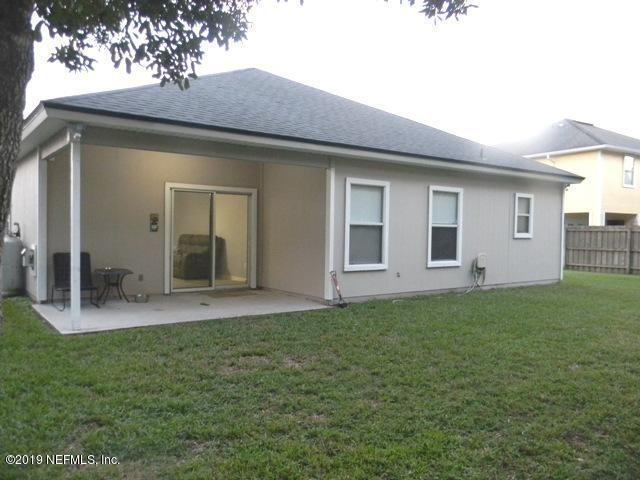 321 Stonehurst Parkway St. Augustine, FL 32092 - Photo 27 of 39 a view of a backyard with plants and a garden