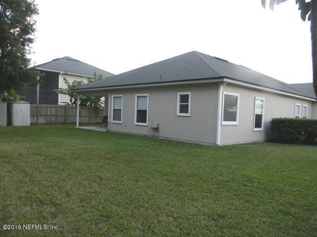 321 Stonehurst Parkway St. Augustine, FL 32092 - Photo 28 of 39 a front view of house with yard and green space