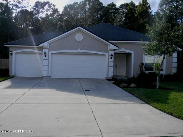 321 Stonehurst Parkway St. Augustine, FL 32092 - Photo 32 of 39 a front view of house with garage and yard