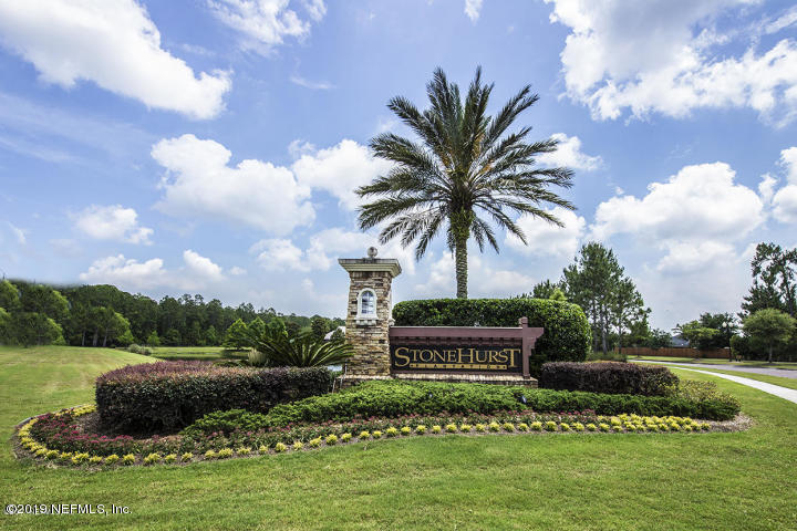 321 Stonehurst Parkway St. Augustine, FL 32092 - Photo 33 of 39 a front view of a house with a garden and statue