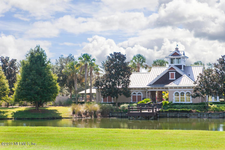 321 Stonehurst Parkway St. Augustine, FL 32092 - Photo 34 of 39 a front view of a house with a garden and swimming pool