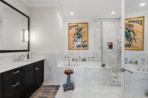 a bathroom with a double vanity sink mirror and shower